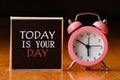 Retro alarm clock and the text `today is your day `. Royalty Free Stock Photo