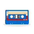 Retro audio cassette in blue color isolated on a white background. Vintage style music storage icon. Royalty Free Stock Photo