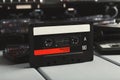 Vintage audio cassettes and tape recorder at gray background Royalty Free Stock Photo