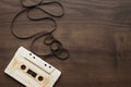 Retro audio cassette over wooden background