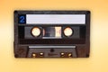 Retro audio cassette tape on yellow background Royalty Free Stock Photo