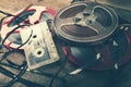 Retro audio reels and cassette on wooden table