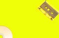 Retro background or banner. Cassettes and disk on a multi-colored yellow background. Blank with copyspace Royalty Free Stock Photo