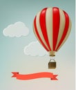 Retro background with colorful air balloons and clouds.