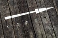 White arrow on a wooden