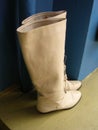 Retro Beige Boots Against Blue Wall Royalty Free Stock Photo