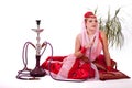 Retro bellydancer posing with hookah