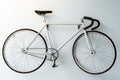 Retro bicycle hanging on the white wall