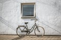 Retro bicycle on roadside with vintage concrete wall background Royalty Free Stock Photo