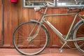 retro bicycle on vintage wooden house wall Royalty Free Stock Photo