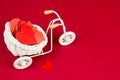 retro bike with white wicker basket full of red paper hearts Royalty Free Stock Photo