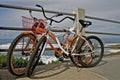 Retro Bikes Leaning Against Railing