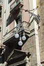 Black classic lamppost of wrought iron in Barcelona, Catalonia,