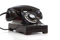A retro black rotary phone on a white background Royalty Free Stock Photo