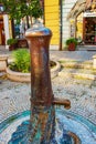 Retro borehole pump on a sunny day, old manual water pump (lever pump). Monument in Slovakia in the city of Nitra Royalty Free Stock Photo