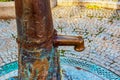 Retro borehole pump on a sunny day, old manual water pump (lever pump). Monument in Slovakia in the city of Nitra Royalty Free Stock Photo