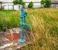 Retro borehole pump on a sunny day, old manual water pump (lever pump). Royalty Free Stock Photo