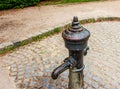 Retro borehole pump on a sunny day, old manual water pump