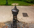 Retro borehole pump on a sunny day, old manual water pump