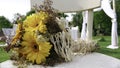 Retro bouquet of yellow  Gerber daisy on a white chair at the wedding Royalty Free Stock Photo