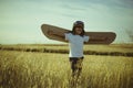 Retro, Boy playing to be airplane pilot, funny guy with aviator Royalty Free Stock Photo