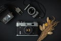 retro camera on the black background. Old gear for photography Royalty Free Stock Photo