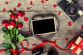 Retro camera and blank photo frame in heart shaped film Royalty Free Stock Photo