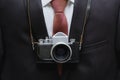 Retro camera with business suit background. Retro background. Royalty Free Stock Photo