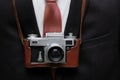 Retro camera with business suit background. Retro background. Royalty Free Stock Photo