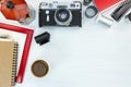 Retro camera, coffee pot, red photo frame and notebook on white Royalty Free Stock Photo