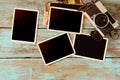 Retro camera and empty old instant paper photo album on wood table Royalty Free Stock Photo