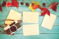 Retro camera and empty old instant paper photo Royalty Free Stock Photo