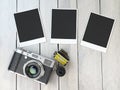 Retro camera, empty photo frames pictures and film canisterrs o Royalty Free Stock Photo