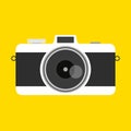 Retro camera in a flat style on a colored background. Old camera with strap. Travel and tourist Royalty Free Stock Photo