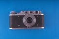 Retro camera in a flat style. Vintage camera on a colored background. Old camera with strap. Isolated antique Camera. Royalty Free Stock Photo