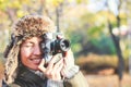 Retro camera in hand of young photographer girl and ready to take photo. Royalty Free Stock Photo