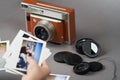 Retro camera and old photo film rolls on gray background Royalty Free Stock Photo