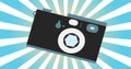 Retro camera old vintage hipster for geeks from the 70s, 80s, 90s against the background of blue rays Royalty Free Stock Photo