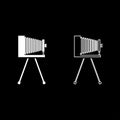 Retro camera on tripod Vintage analog film camera Old photo camera icon outline set white color vector illustration flat style Royalty Free Stock Photo