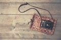 Retro camera with vintage photo album on wooden background Royalty Free Stock Photo