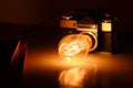 Retro camera, warm Edison bulb Royalty Free Stock Photo