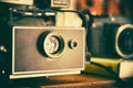 Retro camera on wood table background. Vintage camera. Film came