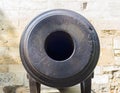 Retro cannon muzzle closeup. Macro gun muzzle front look. Artillery detail. Old iron cannon