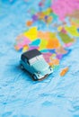 retro car on colorful world map, travel Royalty Free Stock Photo