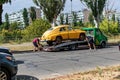 Retro car GAZ M20 Pobeda is loaded onto a tow truck on a city street. Royalty Free Stock Photo