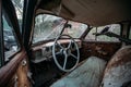 Retro car Interior. Steering wheel of abandoned rusty old car Royalty Free Stock Photo