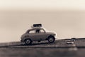 Retro  car with luggage on top. Macro photo. Sepia toned image Royalty Free Stock Photo