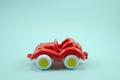 retro car open roof plastic toy red paint isolated on turquoise Royalty Free Stock Photo