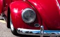 Retro car red color front view. round headlight in chrome trim, red retro car Royalty Free Stock Photo