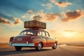 Retro car with a roof rack full of luggage on a backdrop of endless road ahead. Planning summer vacation Royalty Free Stock Photo